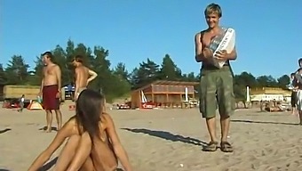A Young, Beautiful Girl Undresses And Frolics At The Seaside
